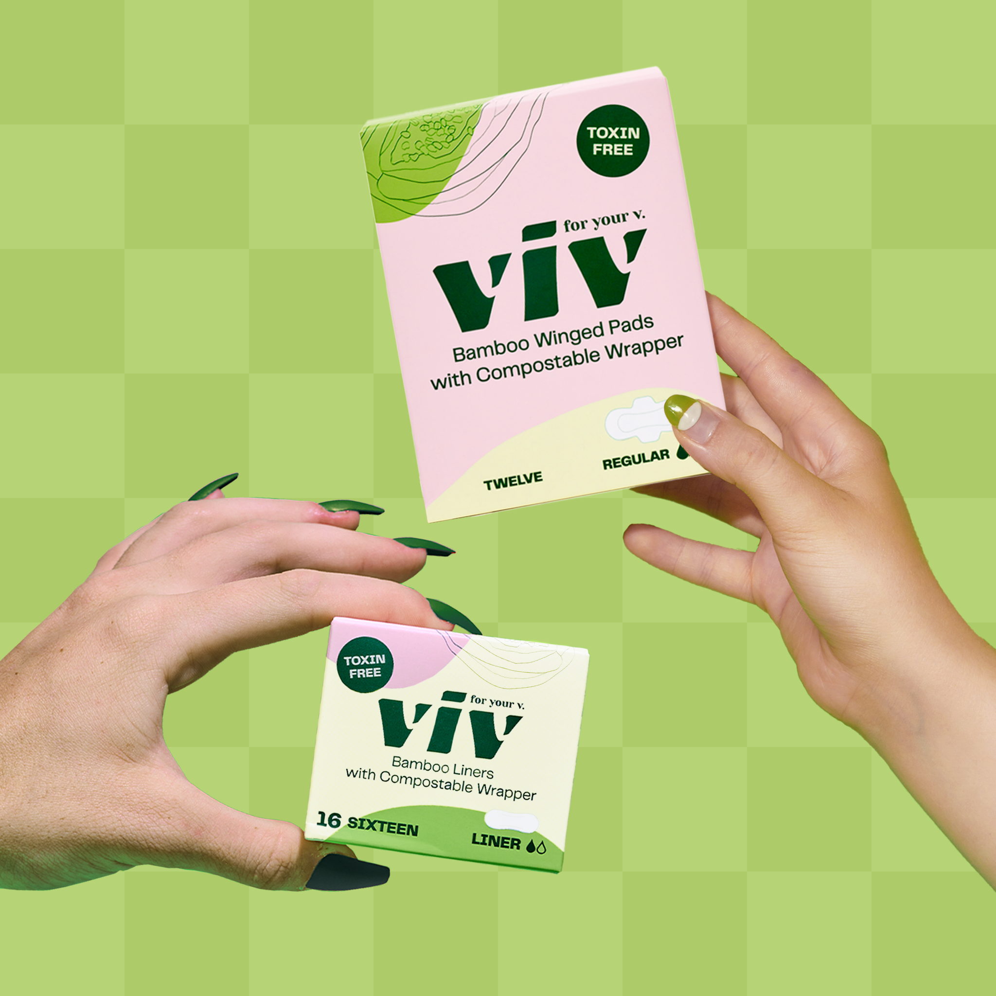 Two individual hands holding a box of bamboo winged pads with compostable wrapper and a box of bamboo liners with compostable wrapper.