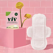 Viv Bamboo Eco-Friendly Winged Menstrual Pads on a pink tile background