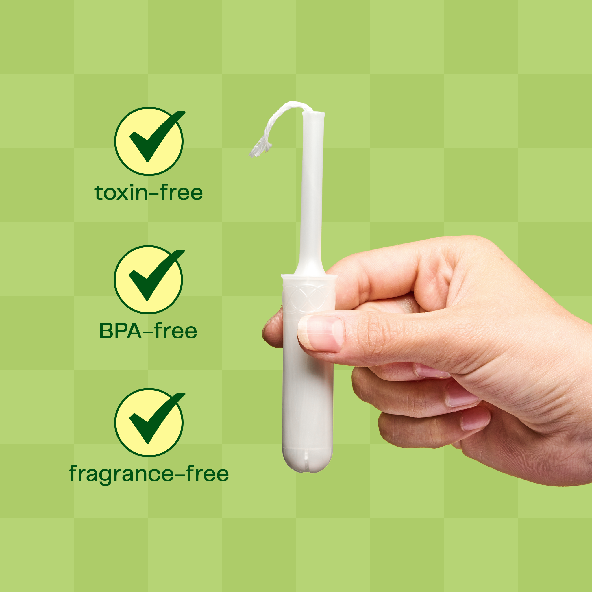 A hand holding a toxin-free, BPA-free and fragrance-free tampon.
