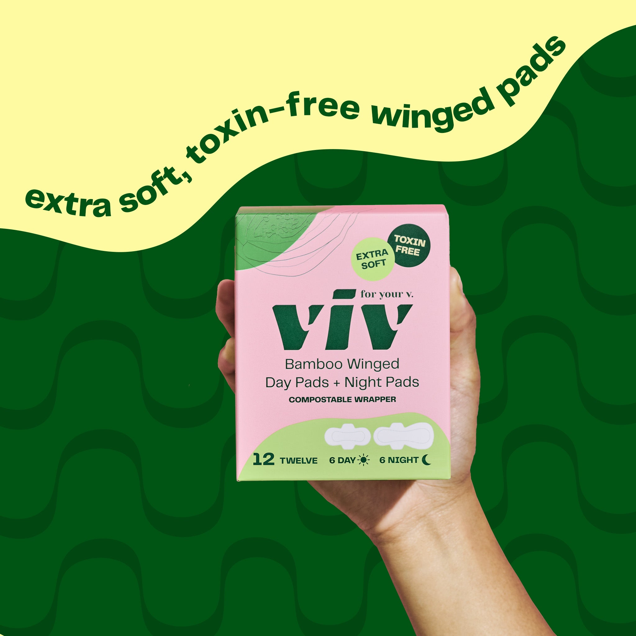 Viv Extra Soft, Toxin-Free & Eco-Friendly Winged Pads, Combo Box: Winged Day Pads and Double-Winged Night Pads box is held up by a hand in front of a green background.